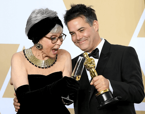 Actor Rita Moreno and director Sebastián Lelio with their Oscars
